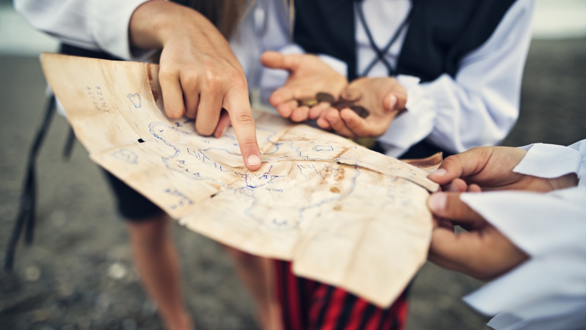kids holding a pirate treasure map