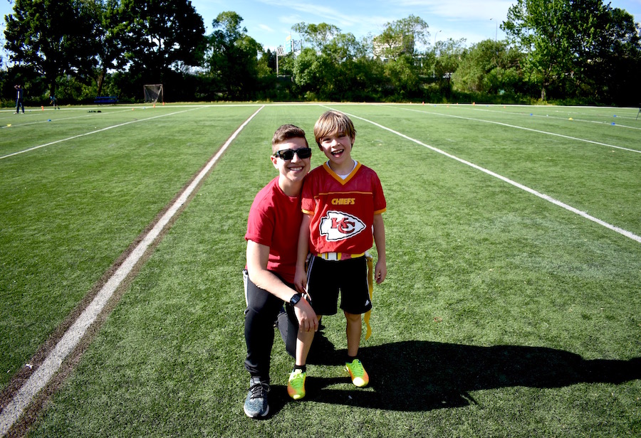 12th Mom Keri Zierler with her son on the field at his football practice in Seattle