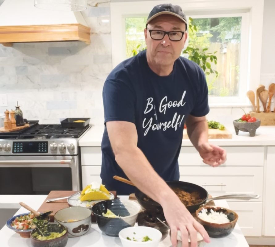 Kenney teaching viewers how to make tacos
