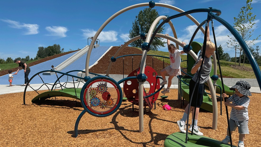 young kids playing on the new playground at Springwood Park in Kent