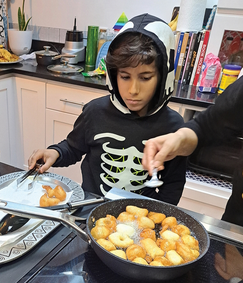 Ali cooking trying new things with family