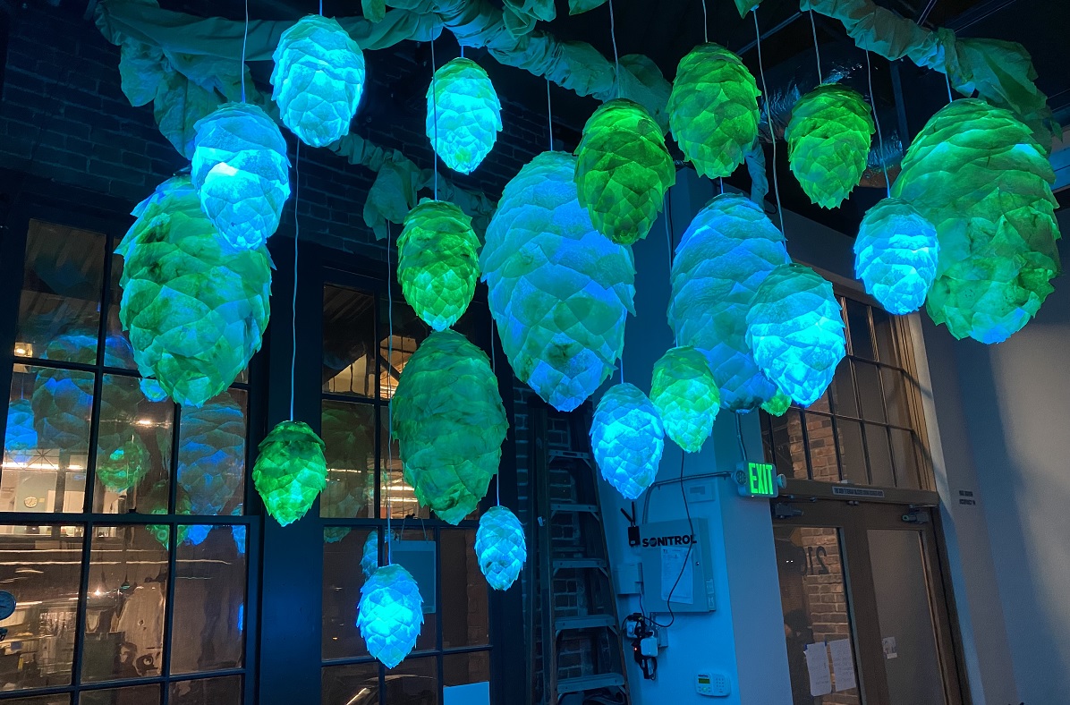 Blue and green lanterns in the shape of hops flowers are one of the displays along the Tacoma Light Trail