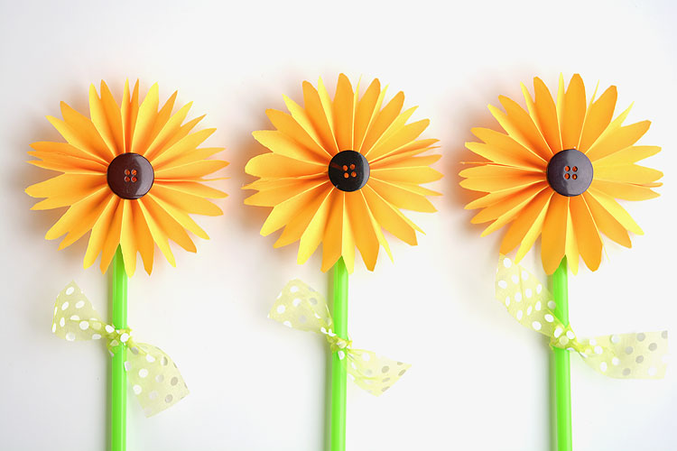 three sunflowers made out of paper
