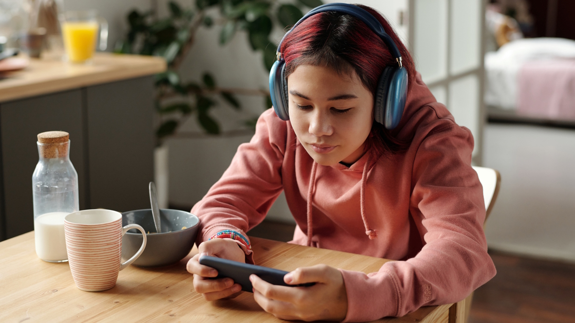 girl watching TikTok videos on her phone