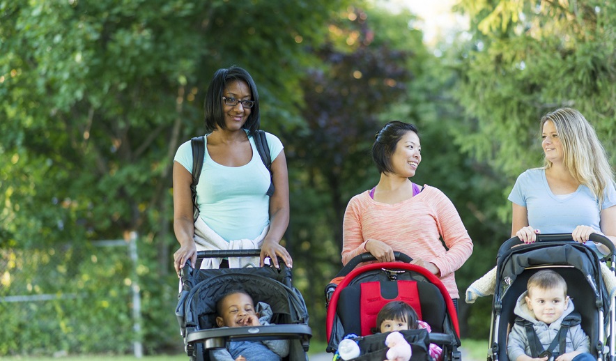 Women pushing strollers