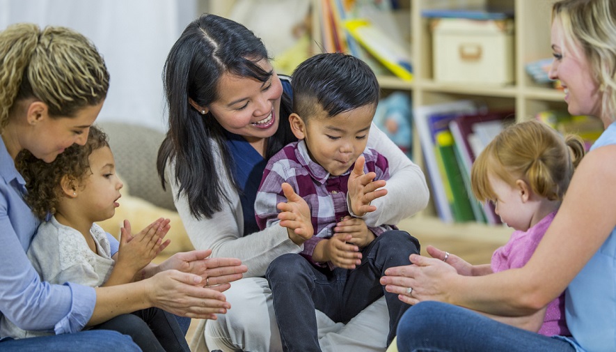 Moms and children playing