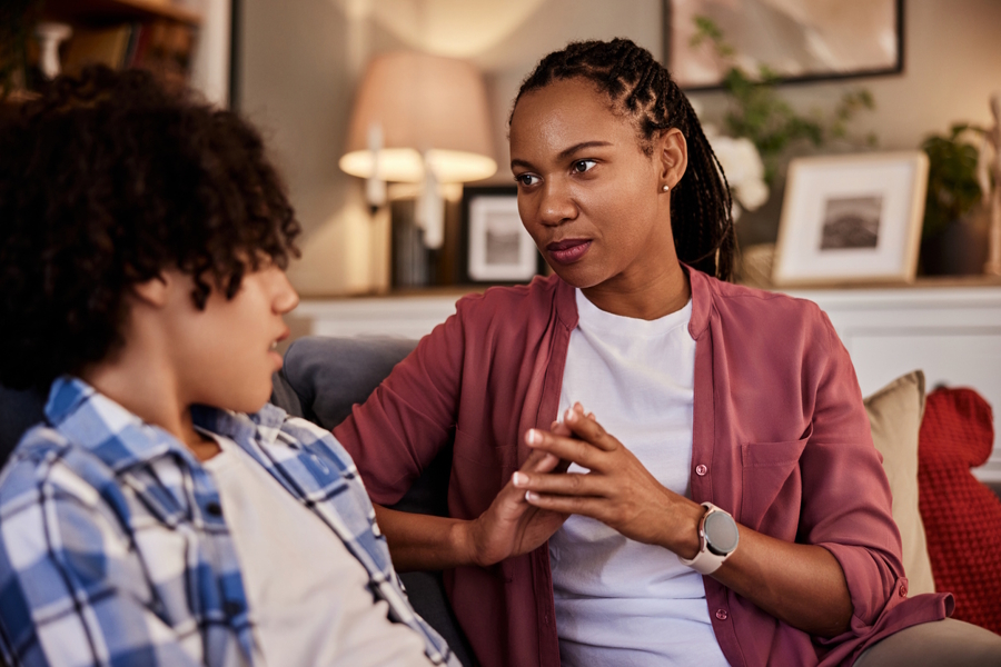 mom talking with son about cell phone use