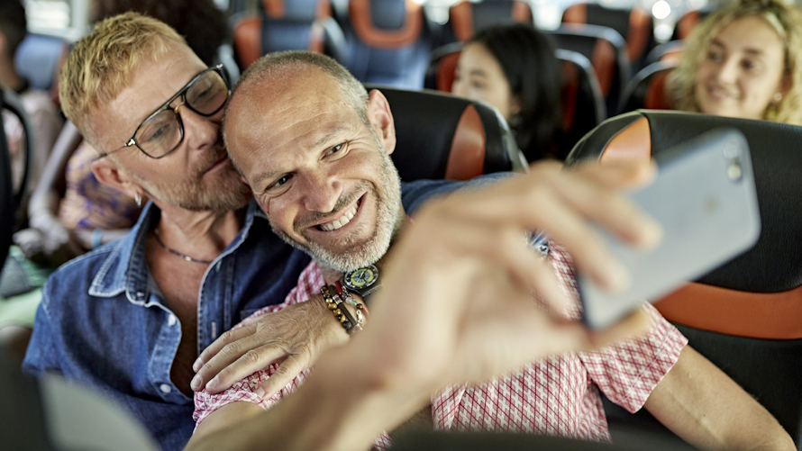 Two men on a kid-free vacation taking a selfie