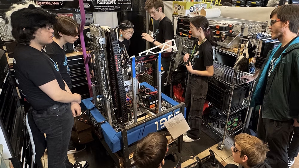 kids working on robotics project with a local club