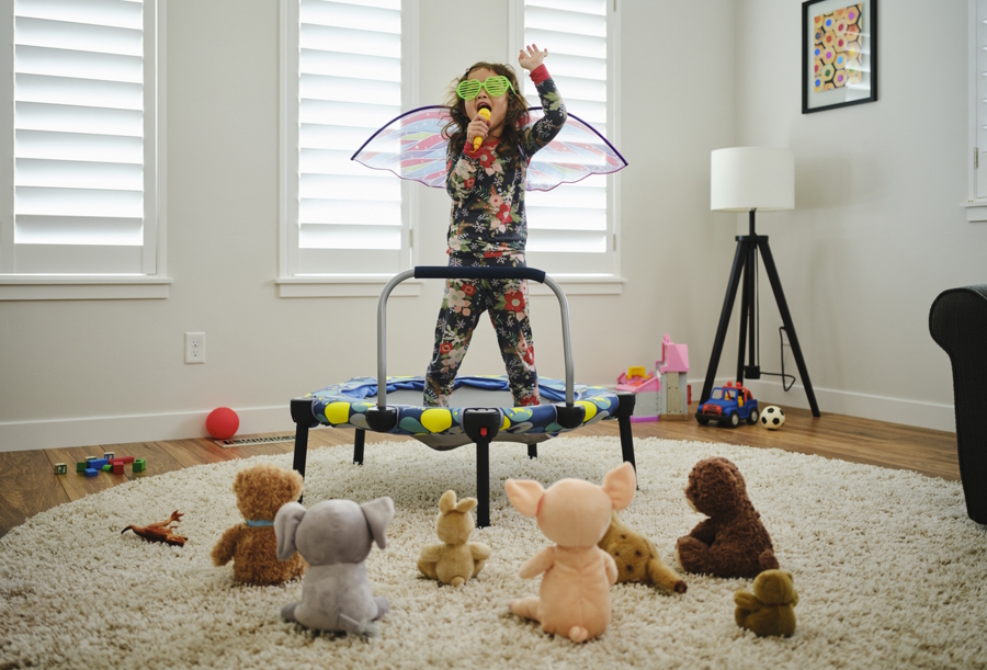 child singing to toys creative play