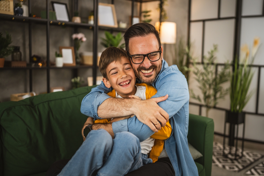 dad hugging son