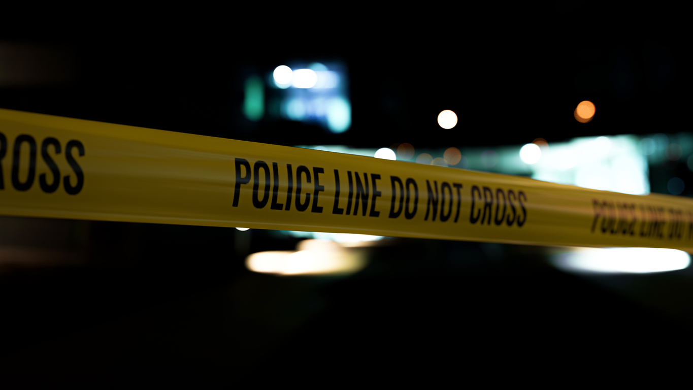Police line do not cross tape at the scene of a shooting
