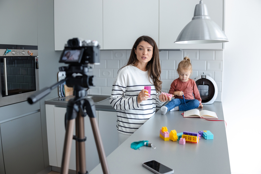 Nanny making a video with the child in her care