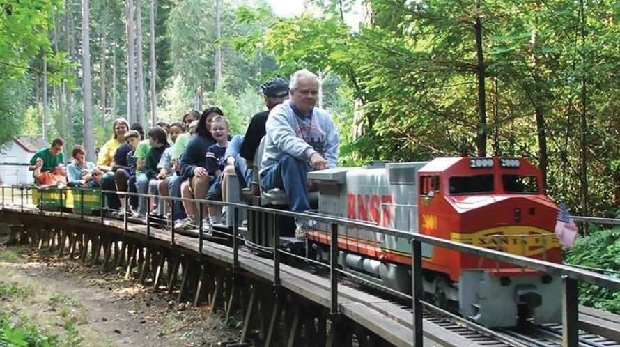 Passengers riding a small train at Port Orchard's South Kitsap Regional Park