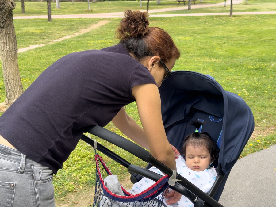 baby sleeping in a stroller
