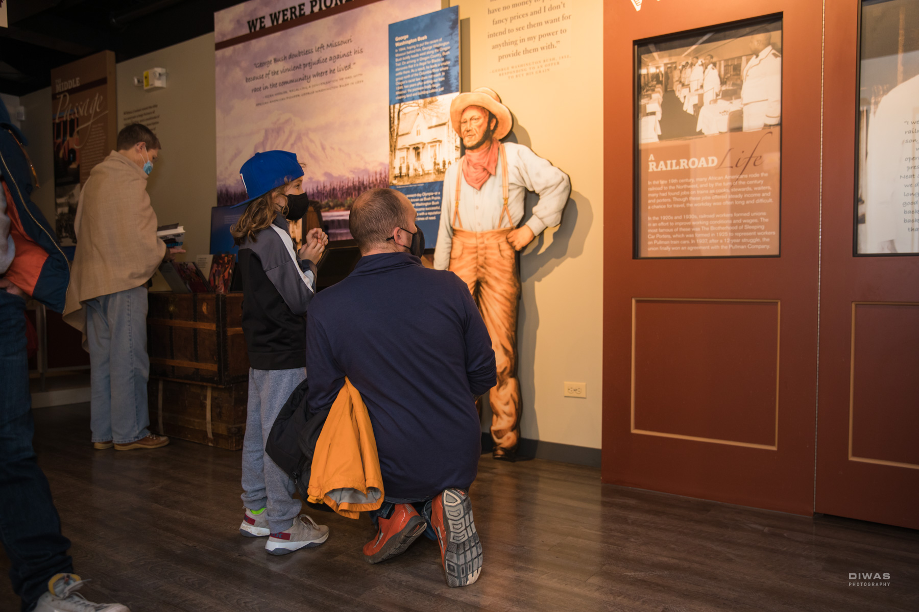 Visitors look at exhibits at the newly reopened Northwest African American Museum in Seattle