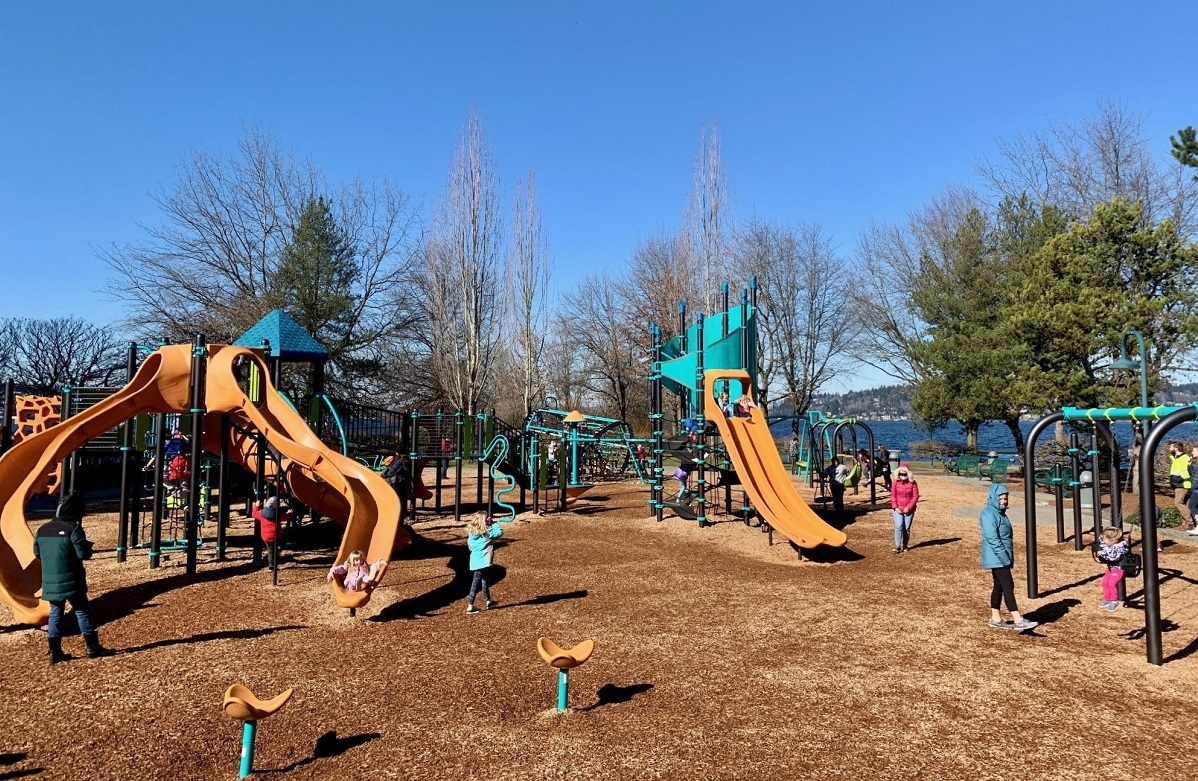 View of the colorful updated playground at Renton’s Gene Coulon Memorial Beach Park near Seattle, among the best most adventurous playgrounds for kids