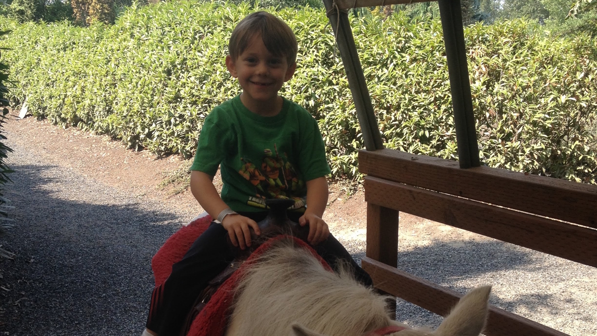 taking a pony ride at Remlinger farms