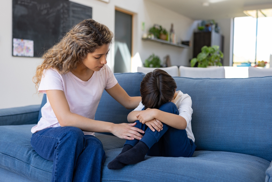Mom and son sitting on a couch