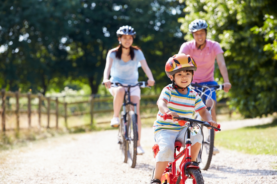 family on a bike ride teach your kids to ride a bike