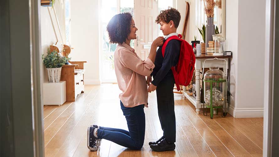 mom getting son ready for school