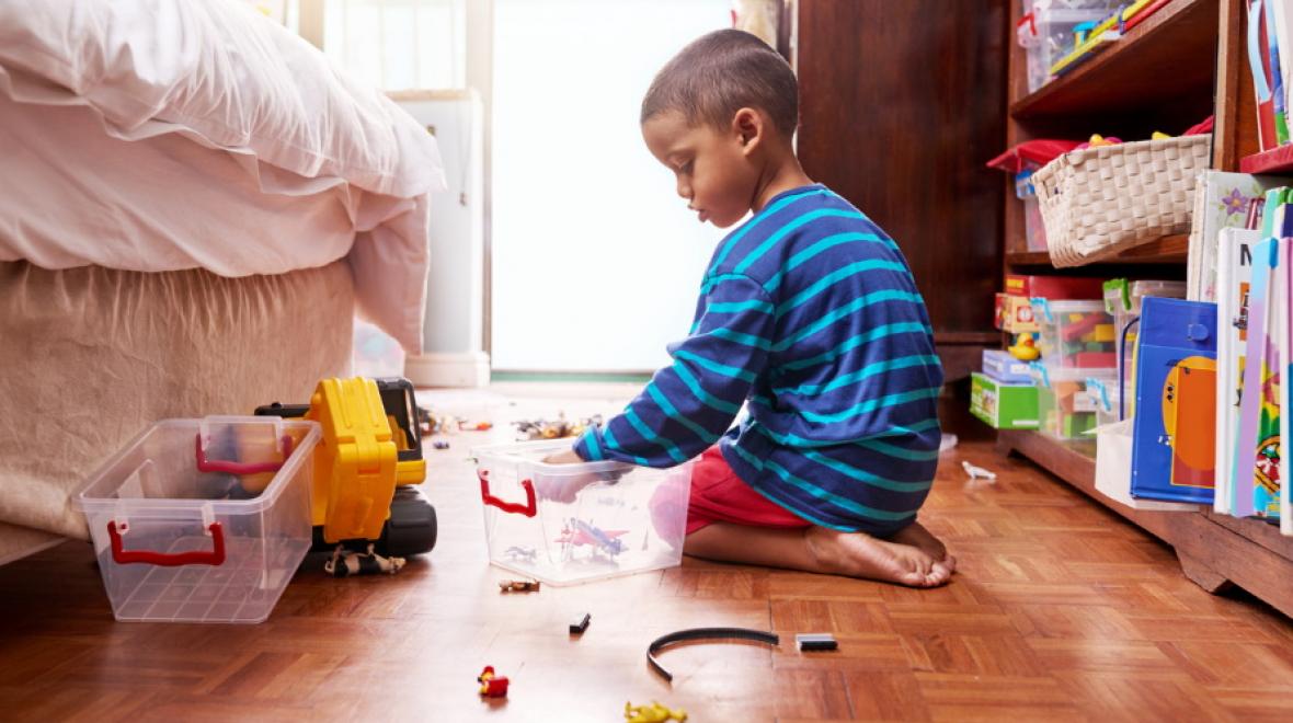 kid cleaning up his room