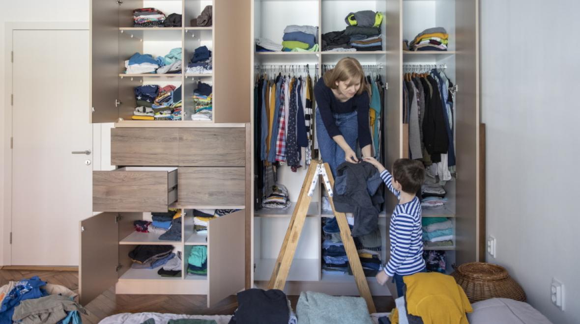 mom and son organizing a closet