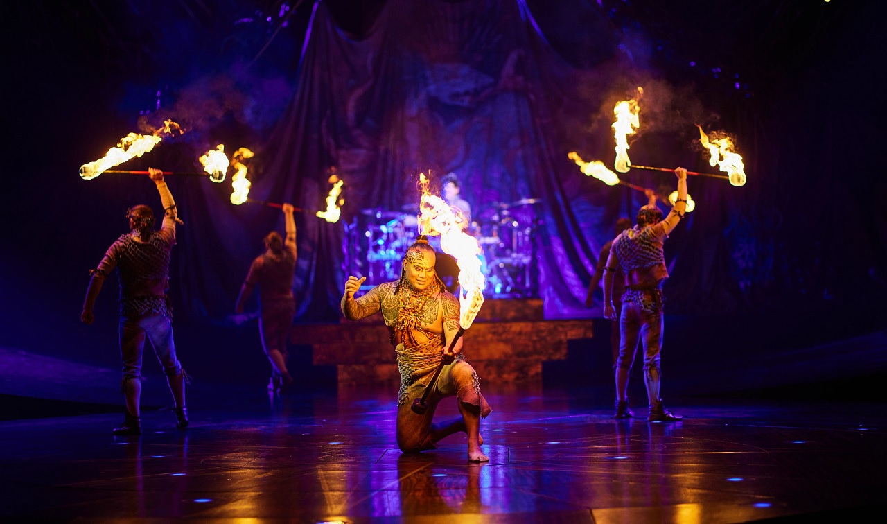 Fire knife dance performer in action at Cirque du Soleil's Alegría currently showing in Redmond, Washington, near Seattle