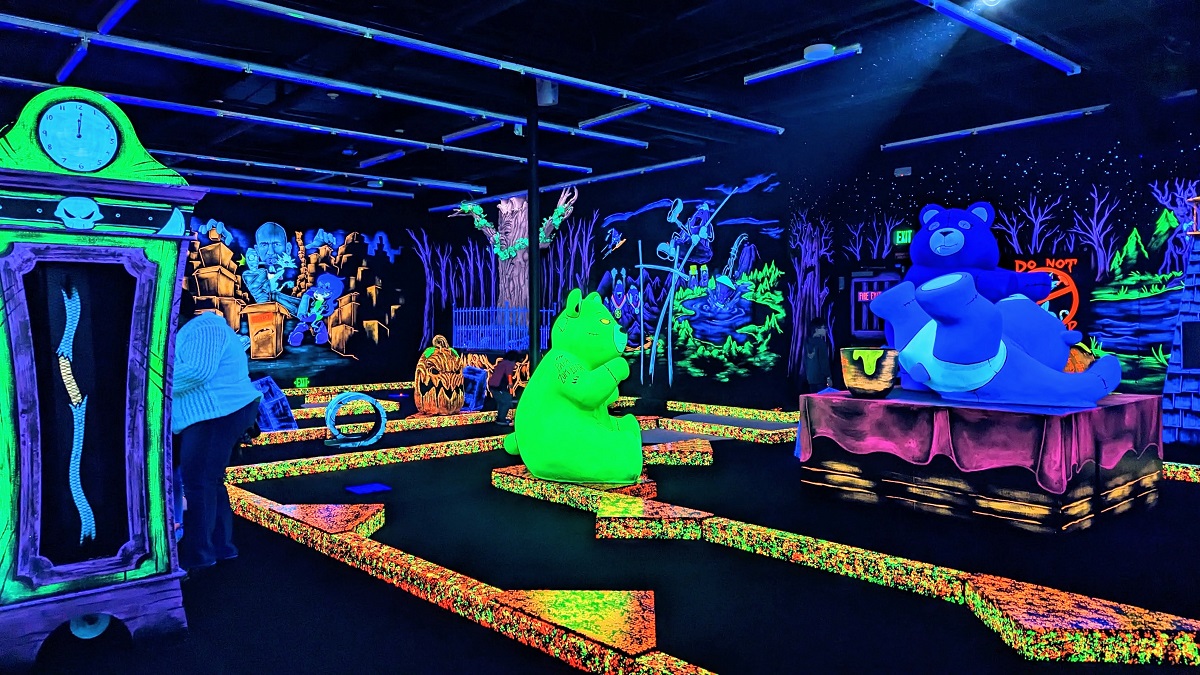 Blacklight Zombears — zombie bears — decorate the indoor mini golf course at Monster Mini Golf newly opened at Bellevue’s Factoria Mall