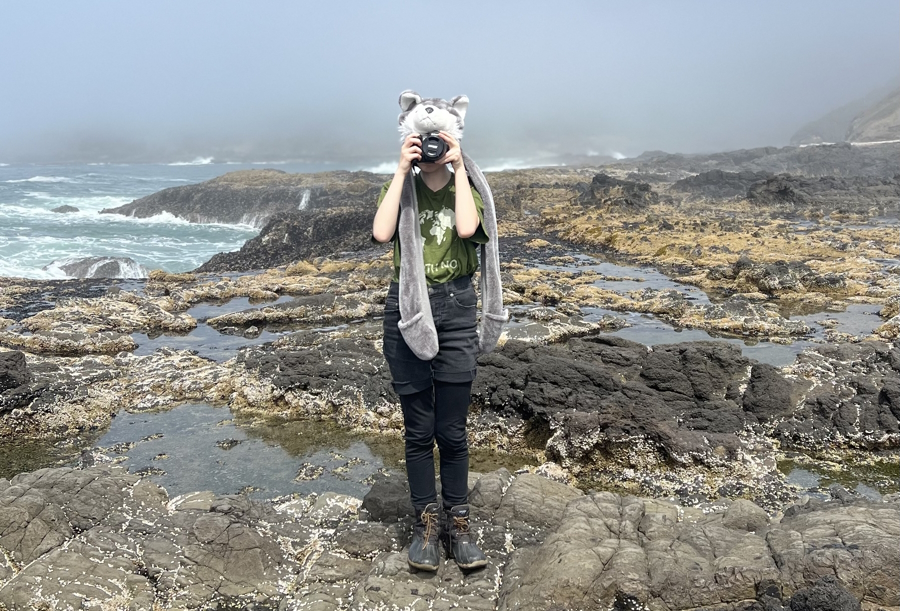 the author's daughter taking a picture and enjoying nature