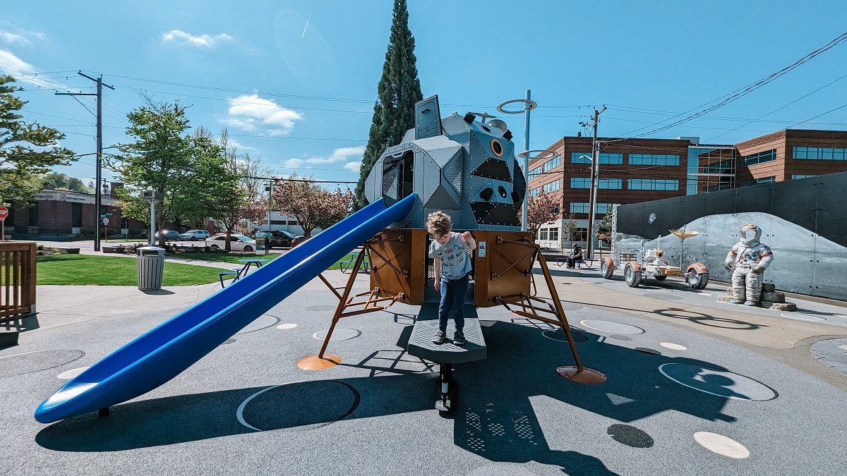A boy stands on the platform entrance the Kherson Park's lunar lander play structure