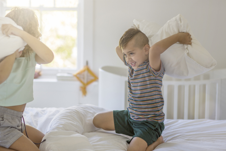 kids play pillow fight
