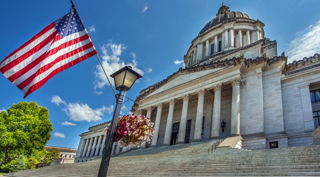 A flag blows in the wind outside the Washington state capitol building where Gov. Ferguson just signed the Parents Rights bill