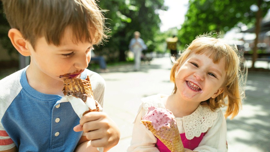 two kids eating ice cream at a park in Enumclaw