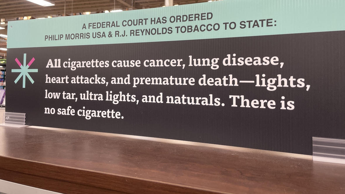 A large sign warning of the health dangers of smoking