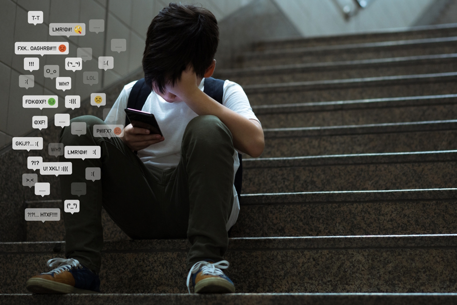 Young boy using social media and feeling bad