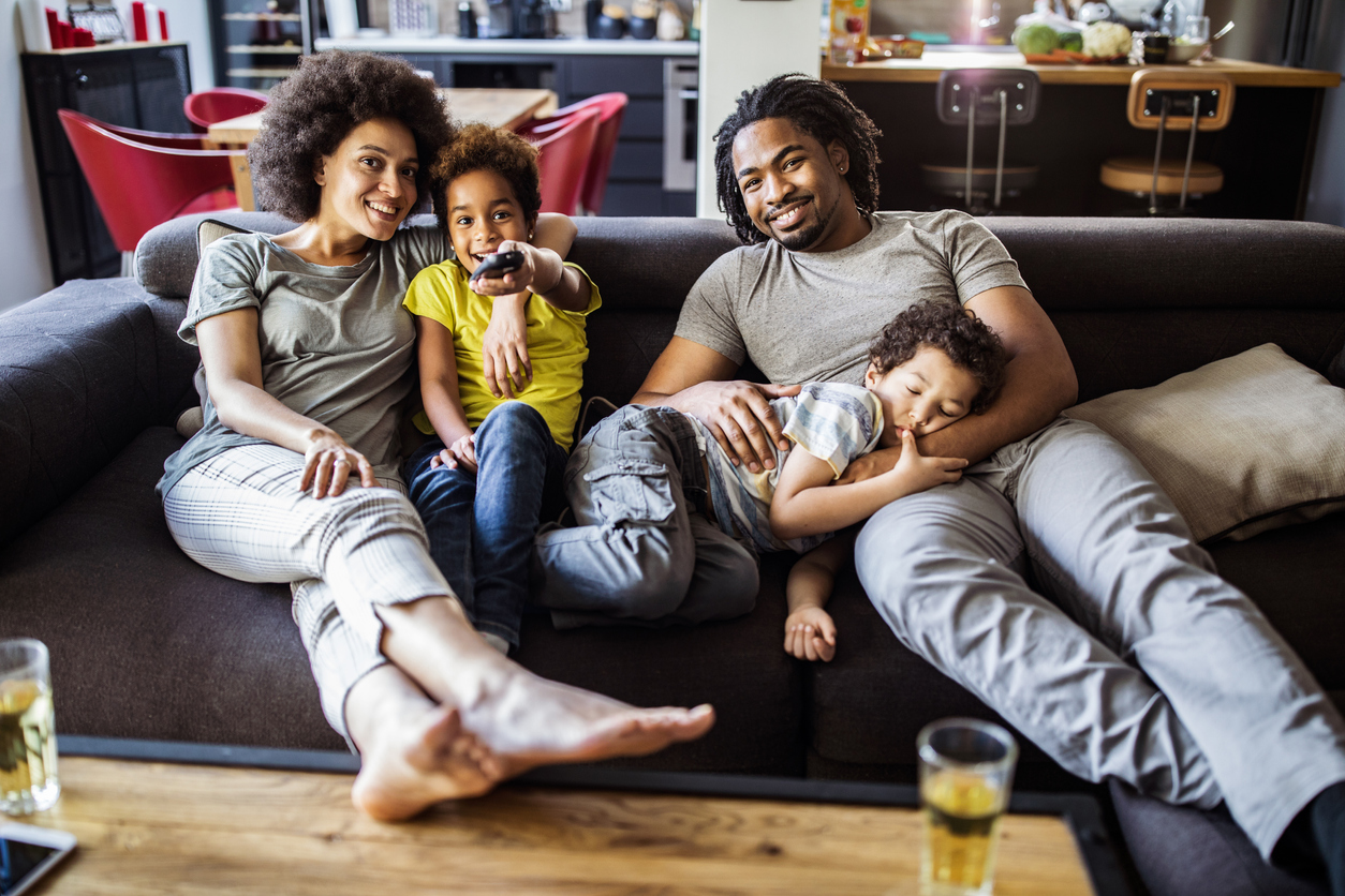 Family watching tv together