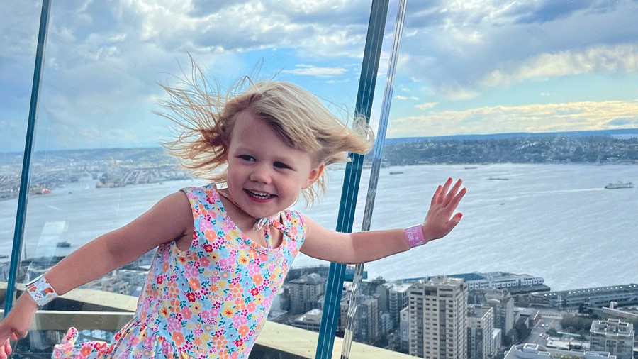 Toddler pressing the glass at the Space Needle, a Seattle thing to do with toddlers