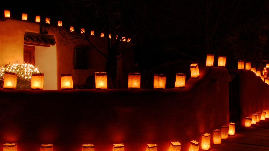 Farolitos around a house at night