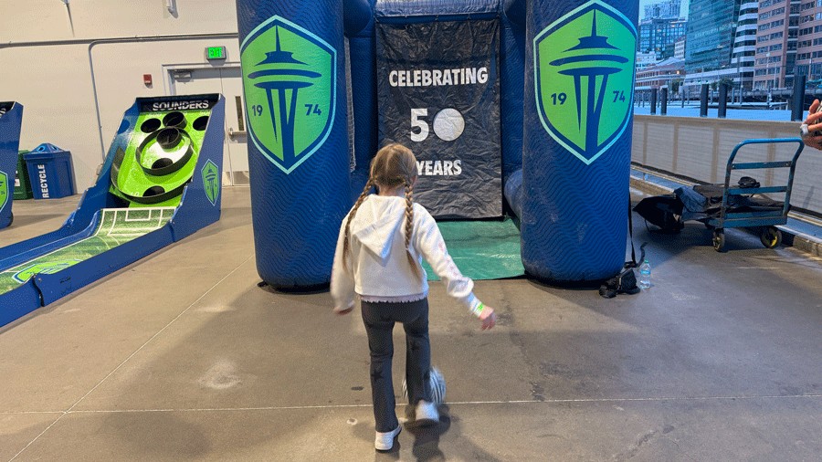 young girl playing soccer before a Sounders game as part of the First Match on Us program