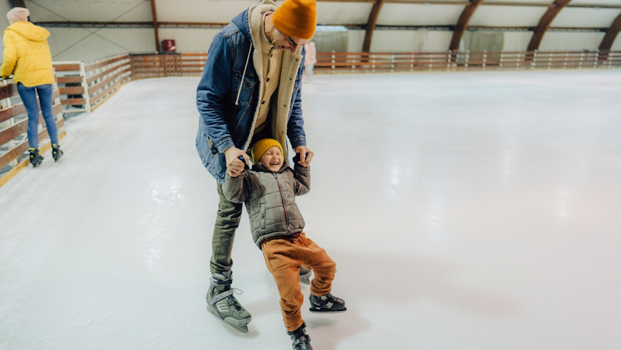 dad and son ice skating one on one time together