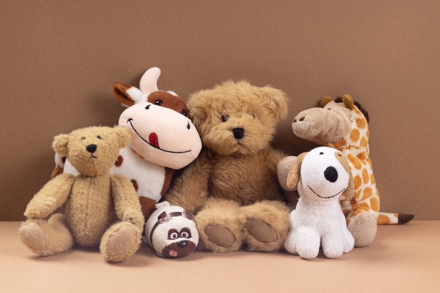 stuffed animals sitting in a row