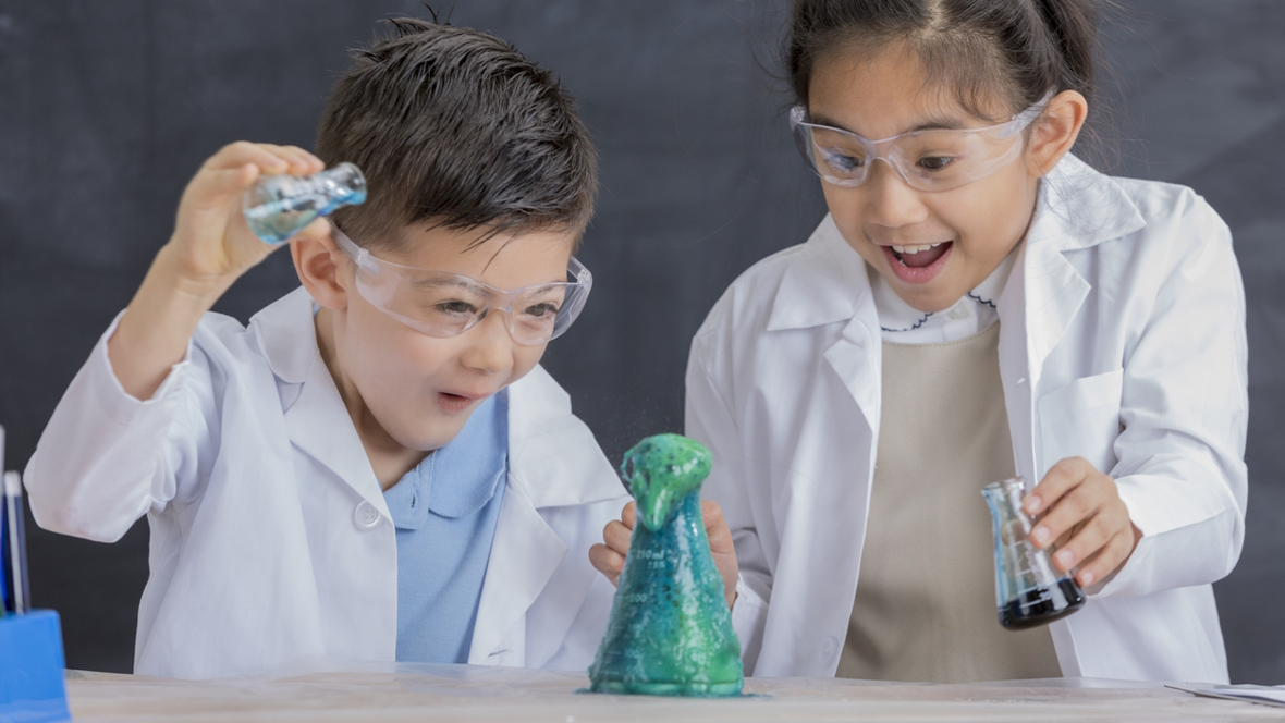 Kids doing a science experiment STEM activities for kids