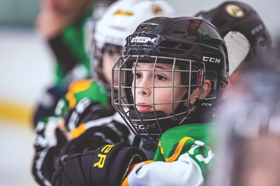 Youth sports boy playing hockey