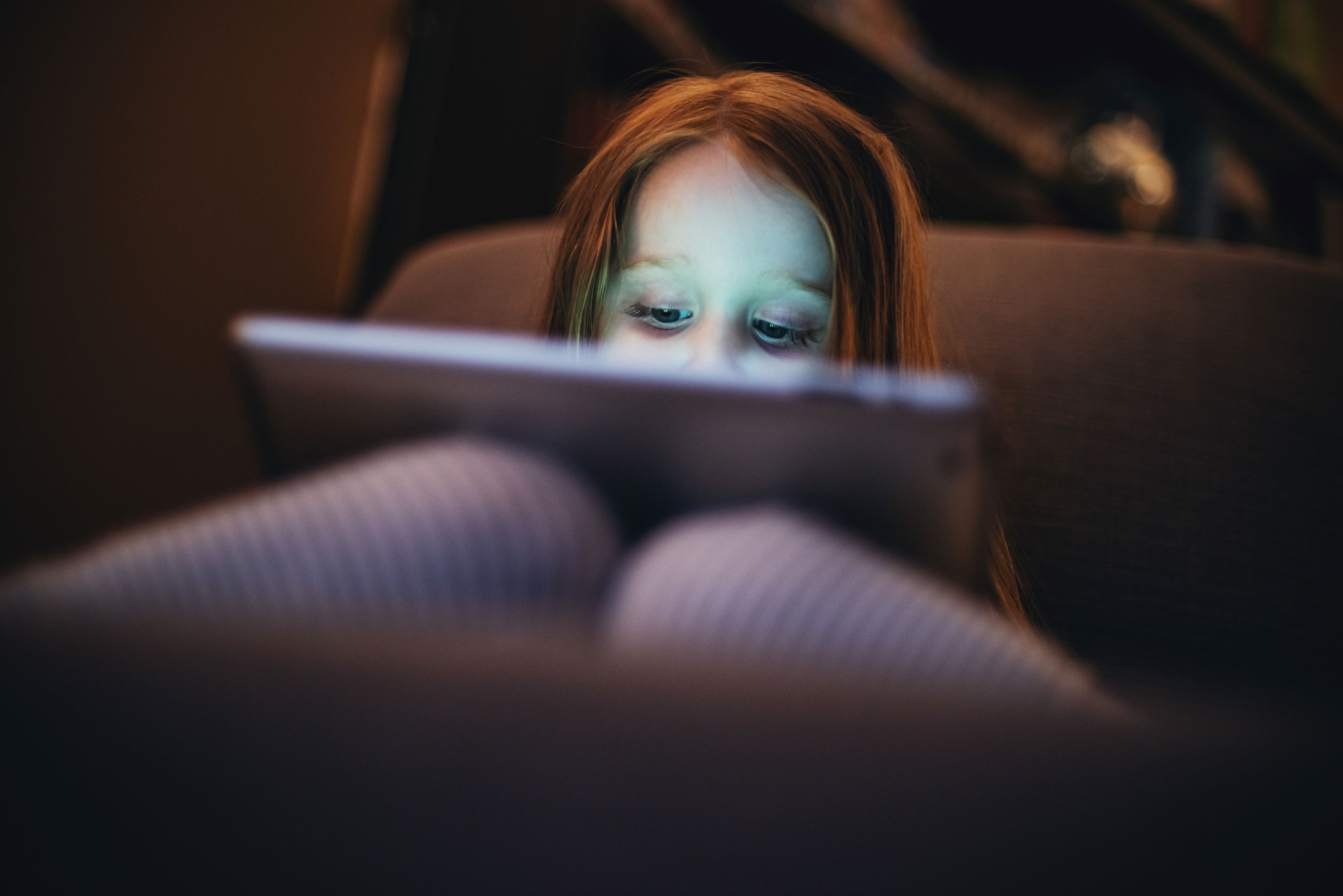 Young girl sitting and watching porn on her computer