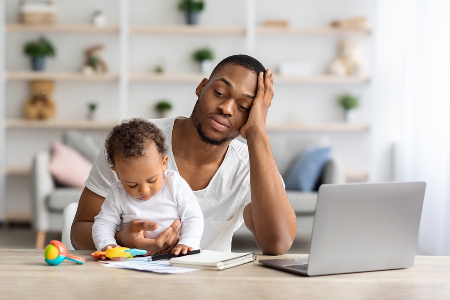 dad with baby feeling parental burnout