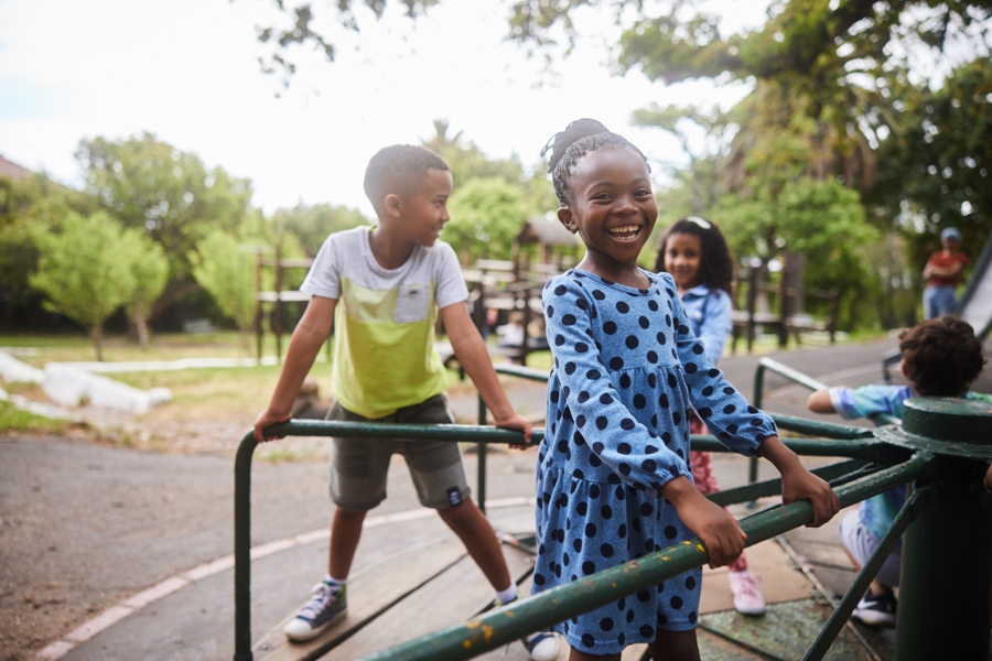 Kids playing on a playground without social media or smart phones