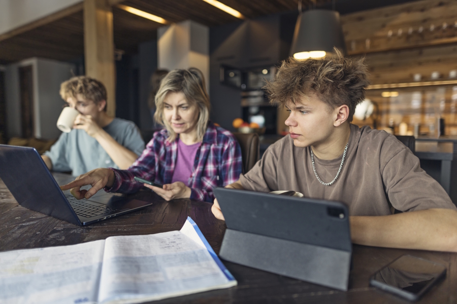 mom and son looking at high school schedule