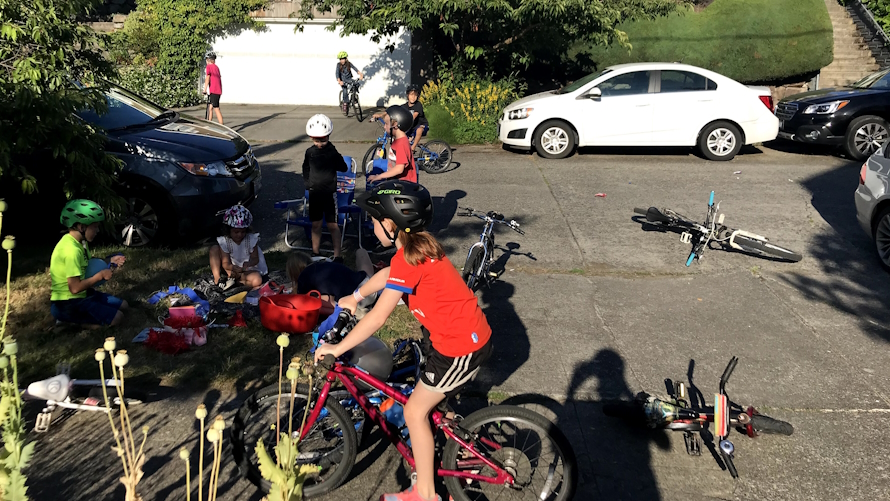 Kids decorating their bikes and getting ready for a bike parade