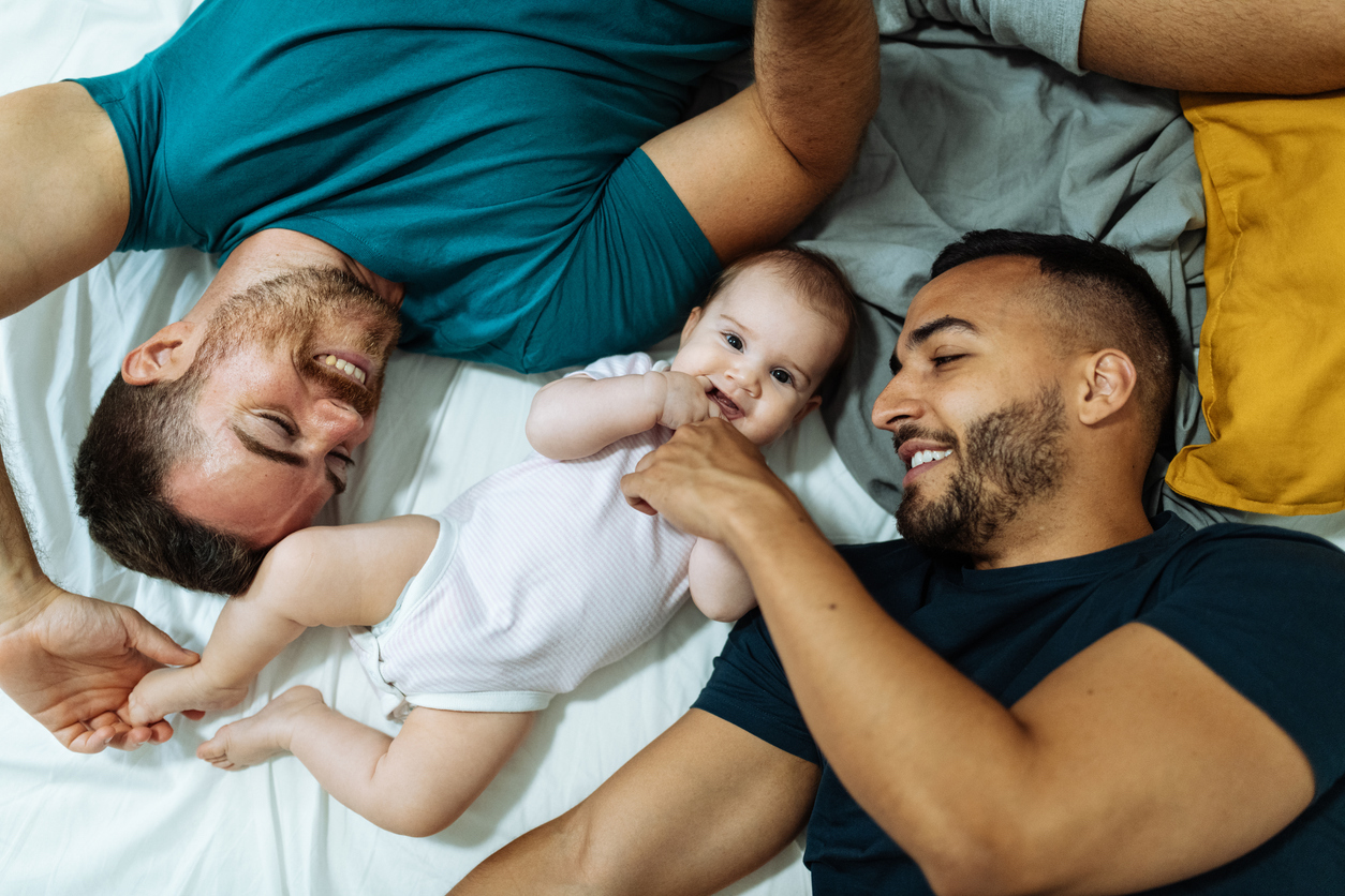 dads smile at their baby